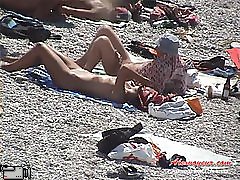 Slim middle-age woman was spotted around men nudists